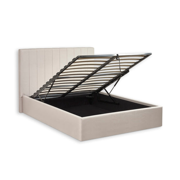 Beige bed frame with black metal headboard on a white background