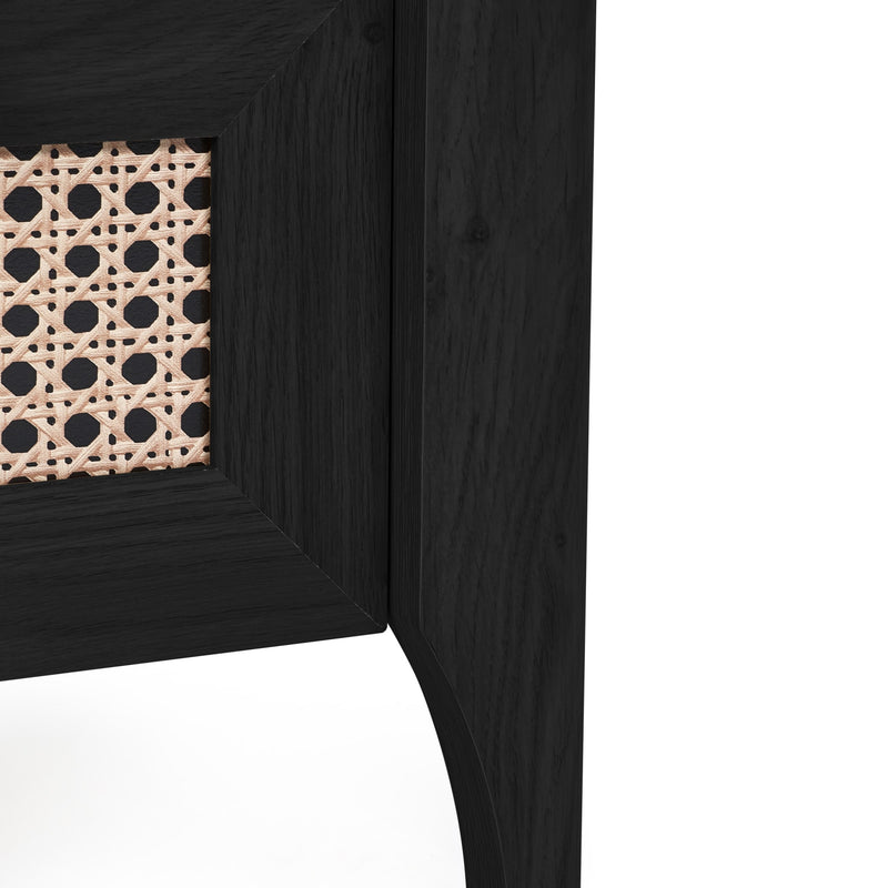 Close-up of black wooden bedside table leg and lower frame