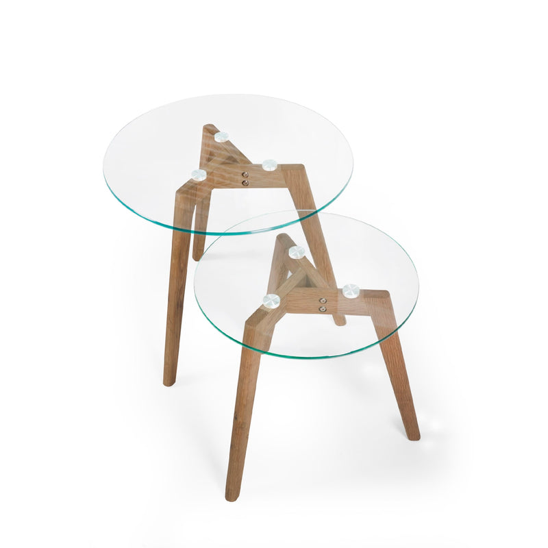 Two glass tables with wooden legs on a white background