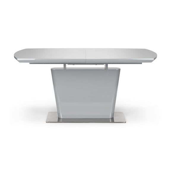 White extending dining table on a white background