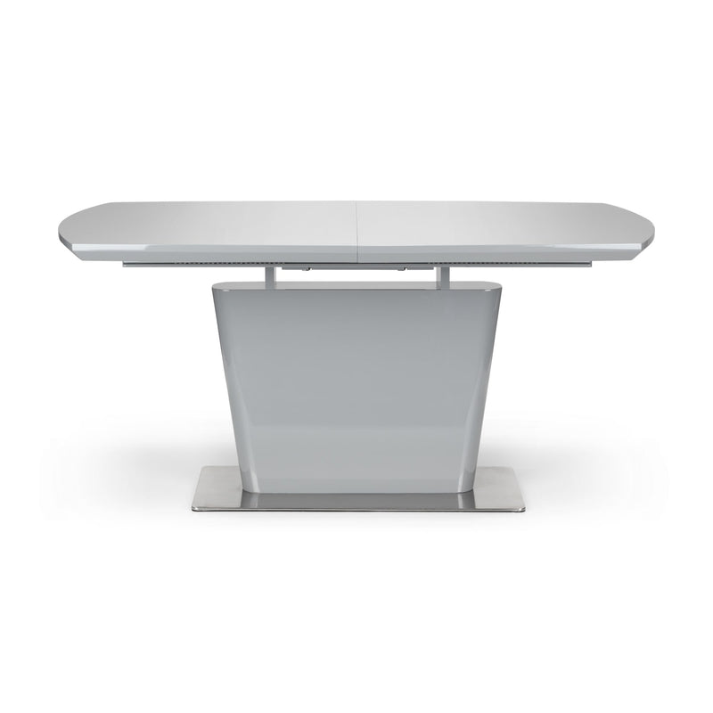 White extending dining table on a white background