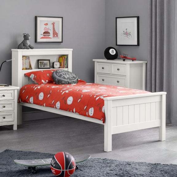 Children's bedroom with white bed, red bedding, and gray walls.