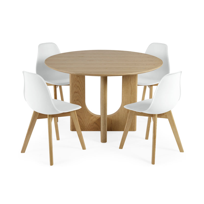 Round wooden table with four white chairs on a white background
