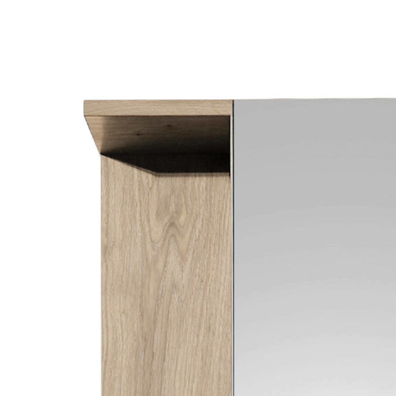 Close-up of a wooden cabinet corner with a white wall background