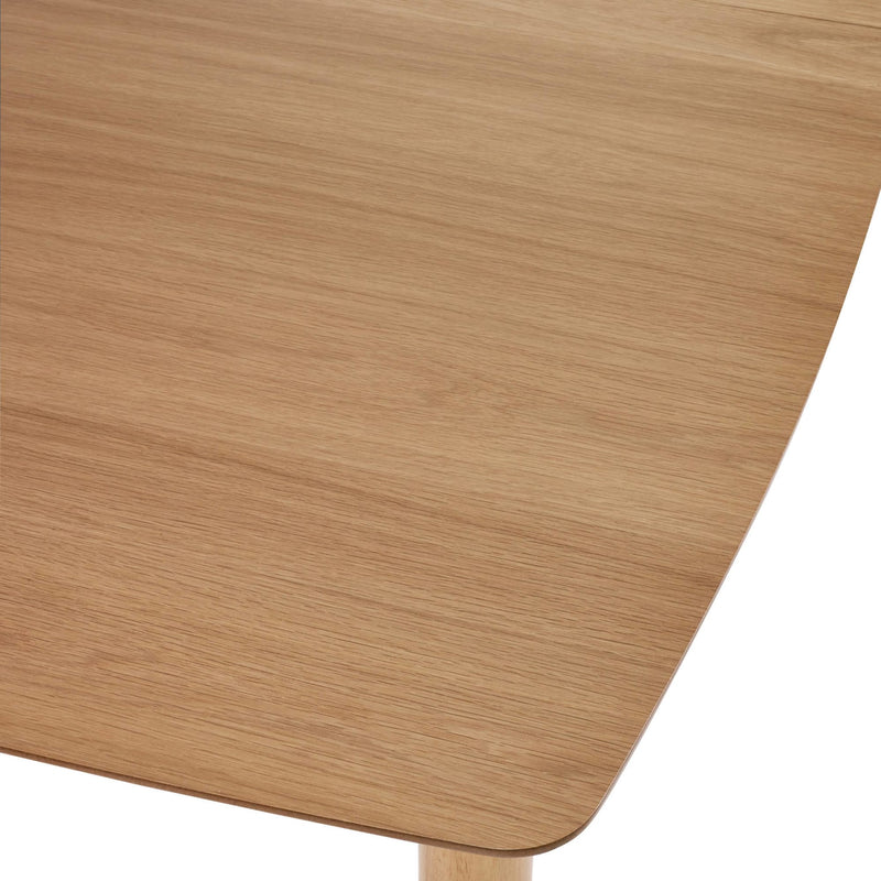Close-up of a wooden surface with a light brown color and visible grain pattern.
