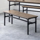 Wooden bench with black metal frame in a room setting