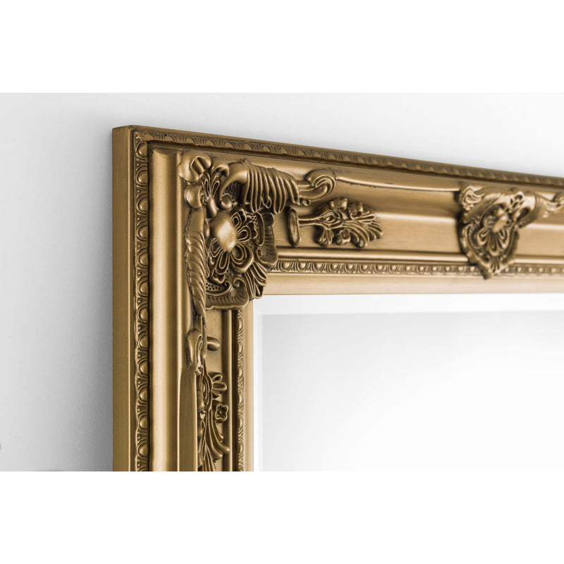 Decorative gold mirror frame on a white background
