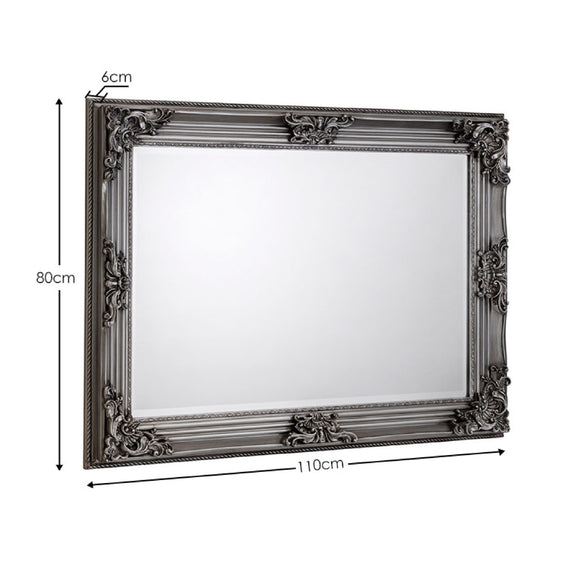 Decorative mirror with ornate frame and dimensions on a white background