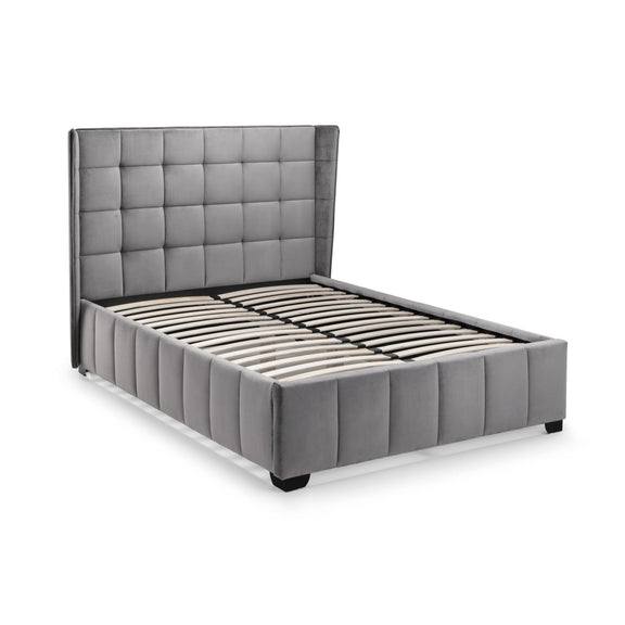 Gray upholstered bed with tufted headboard on a white background
