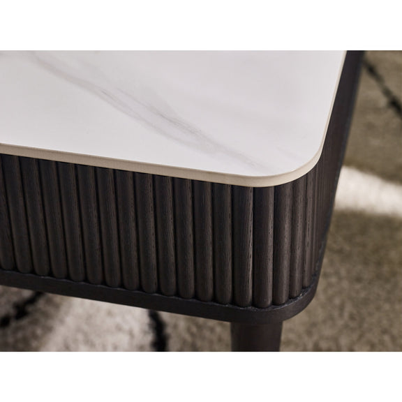 Close-up of a modern side table with a white top and dark brown base.
