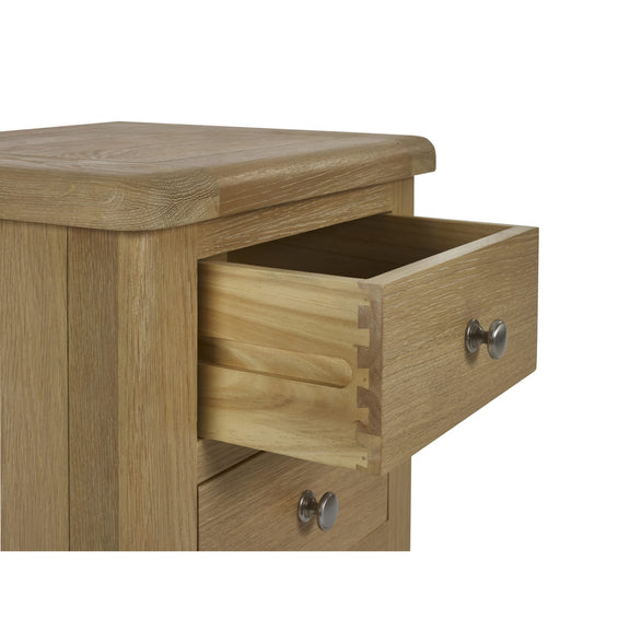 Wooden drawer unit with an open drawer on a white background