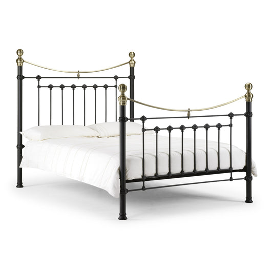 Black metal bed frame with gold accents on a white background