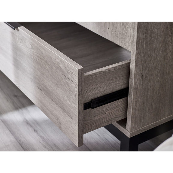 Wooden drawer with a light finish on a wooden floor.
