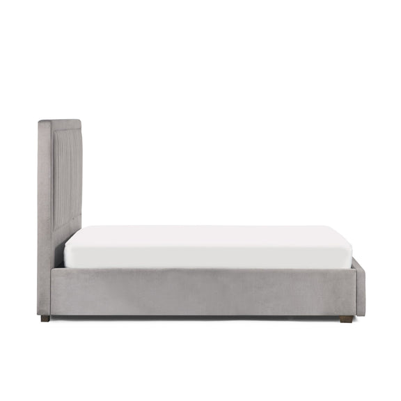Gray upholstered bed with white mattress on a white background