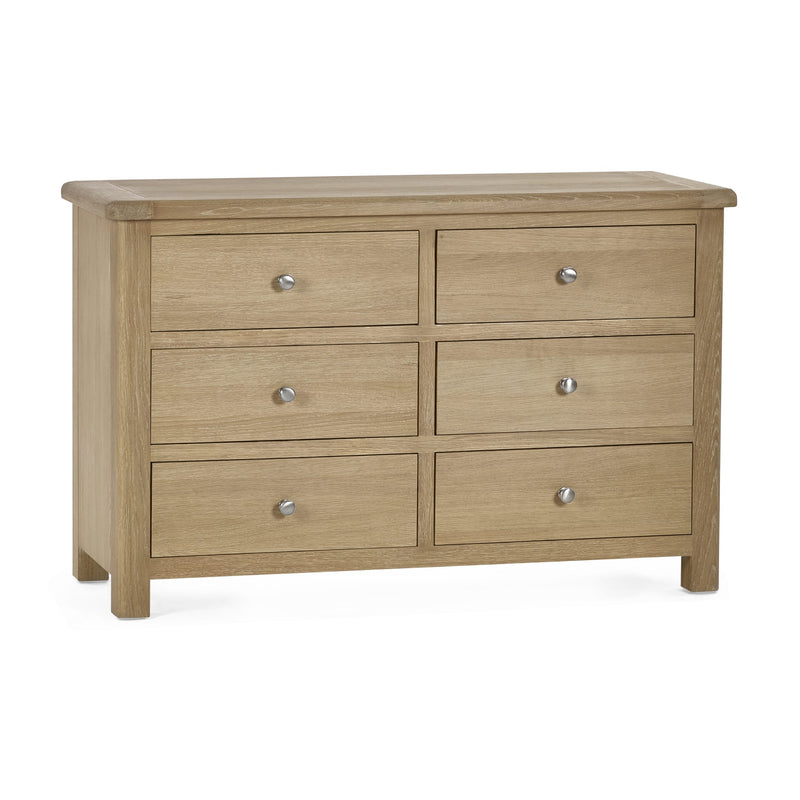 Wooden dresser with six drawers on a white background