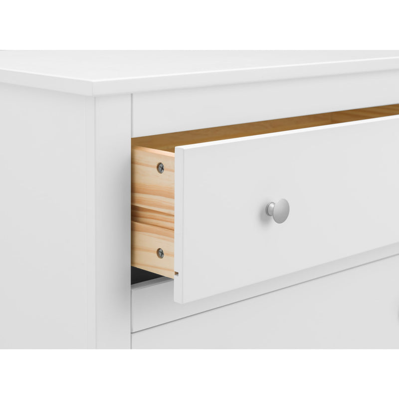 White dresser with a drawer open, showing wooden interior.