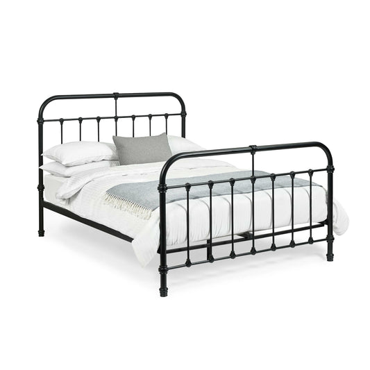 Black metal bed frame with white bedding on a white background