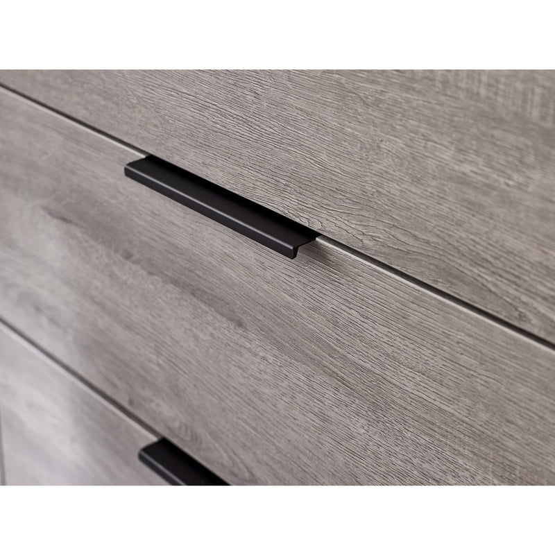 Close-up of a wooden drawer with a black handle on a white background