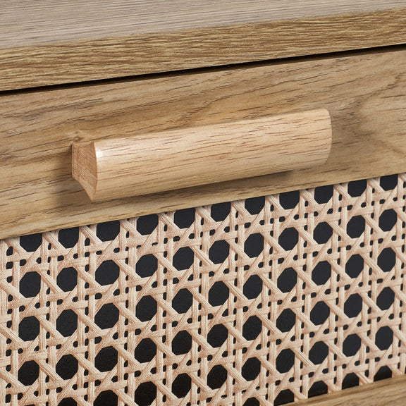 Wooden handle on a piece of furniture with wicker pattern