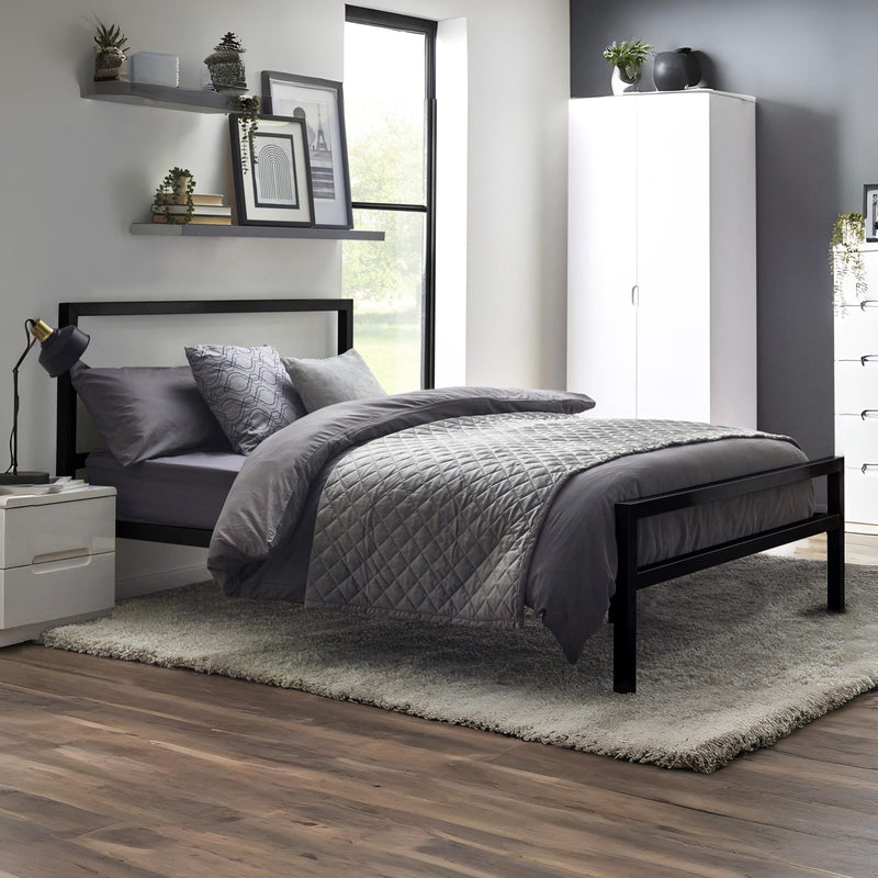 Modern bedroom with a black bed frame, gray bedding, and white wardrobe.