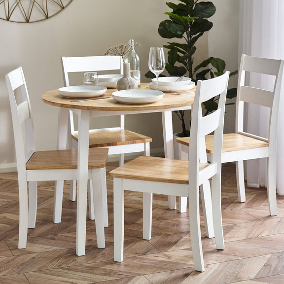 Dining table set with chairs on a wooden floor