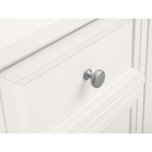 Close-up of a white cabinet with a silver knob on a white background