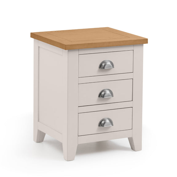 White bedside table with three drawers and a wooden top on a white background