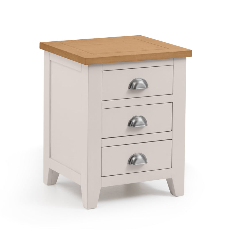 White bedside table with three drawers and a wooden top on a white background