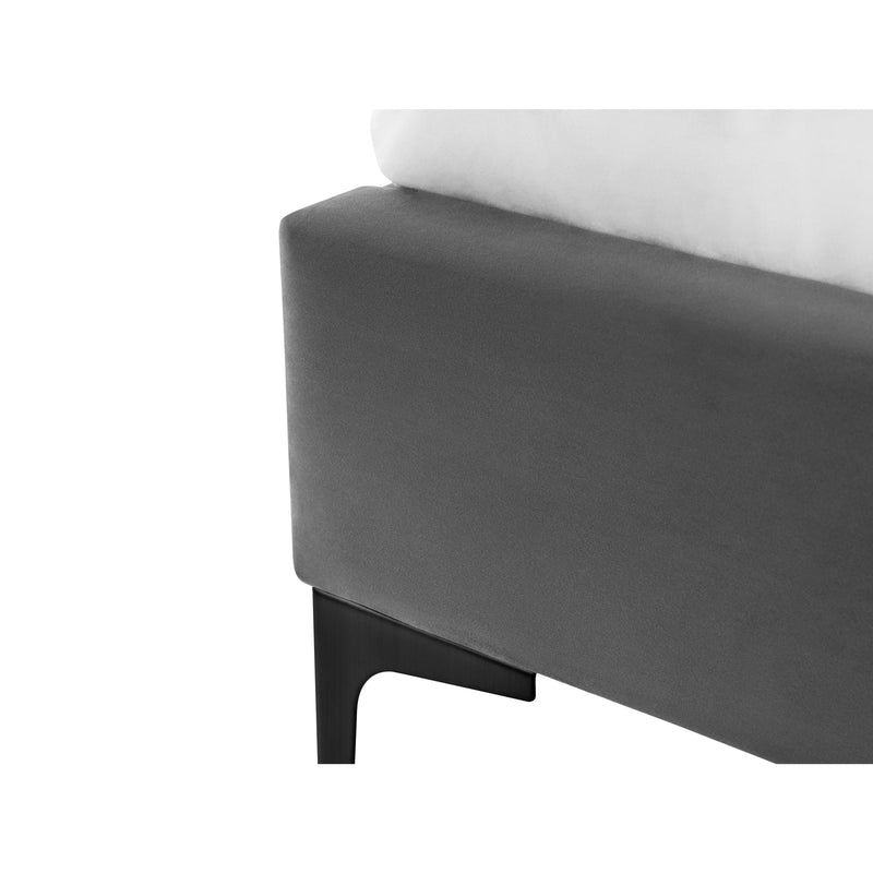 Gray upholstered bed frame with white mattress on a white background