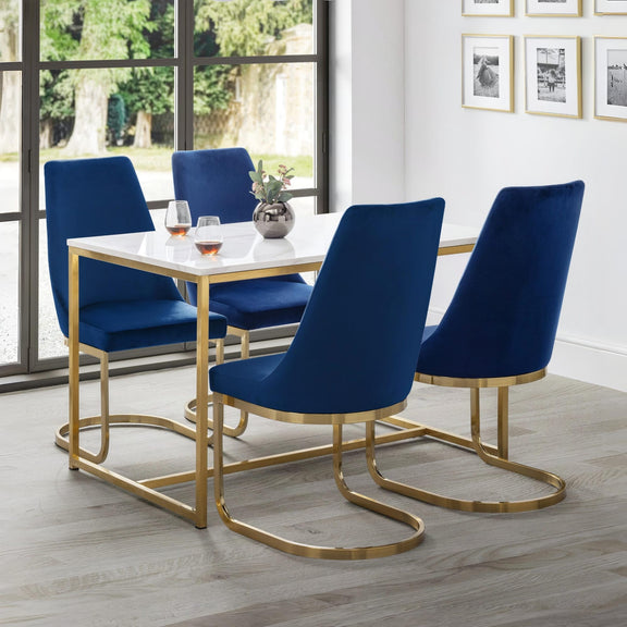 Dining room with blue chairs and a gold table.