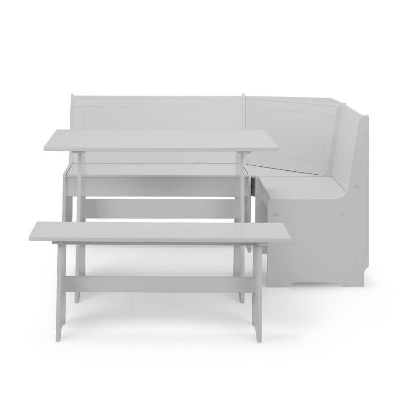 Gray sectional sofa with a small table on a white background