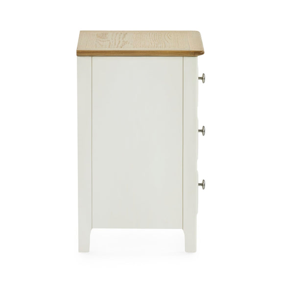White cabinet with a wooden top on a white background