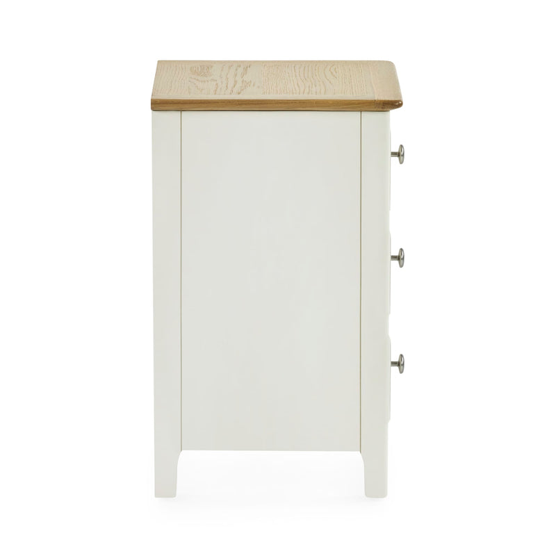 White cabinet with a wooden top on a white background