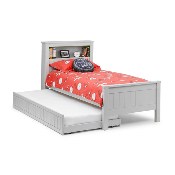 White bed with red bedding and a gray pillow on a white background