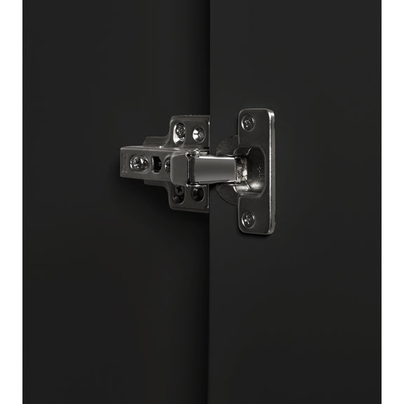 Metallic hinge on a black surface