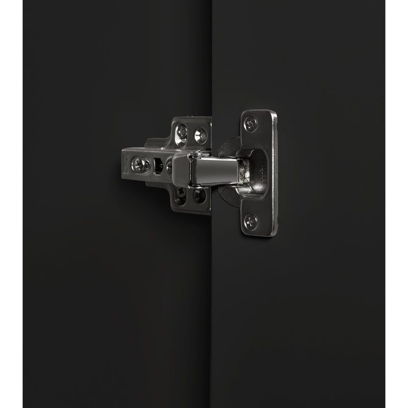 Metallic hinge on a black surface