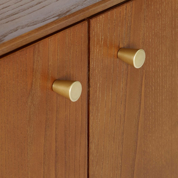 Wooden cabinet with gold knobs