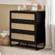 Black dresser with woven drawers in a room setting