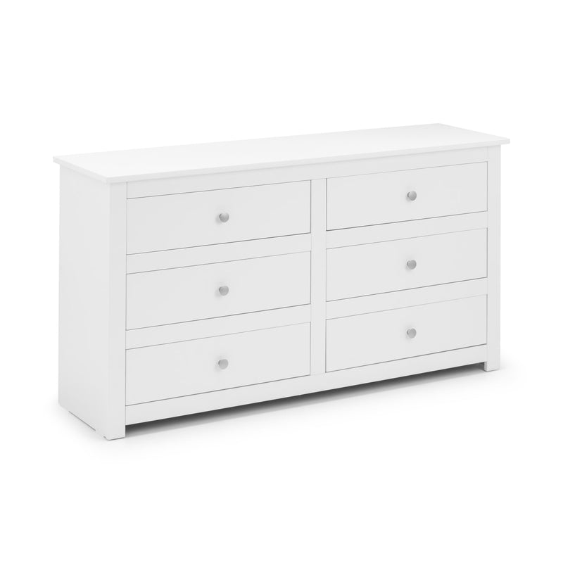White dresser with multiple drawers on a white background