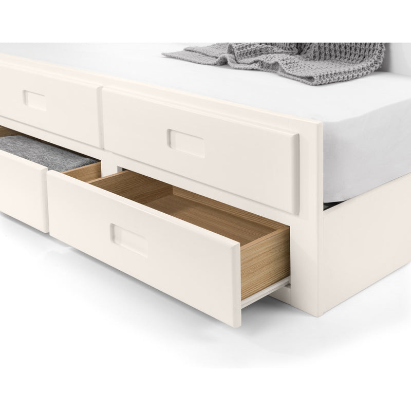 White bed with open drawers revealing wooden interior on a white background