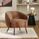 Brown armchair in a living room setting with a side table and decor items.