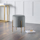 Gray stool with gold legs in a modern room setting