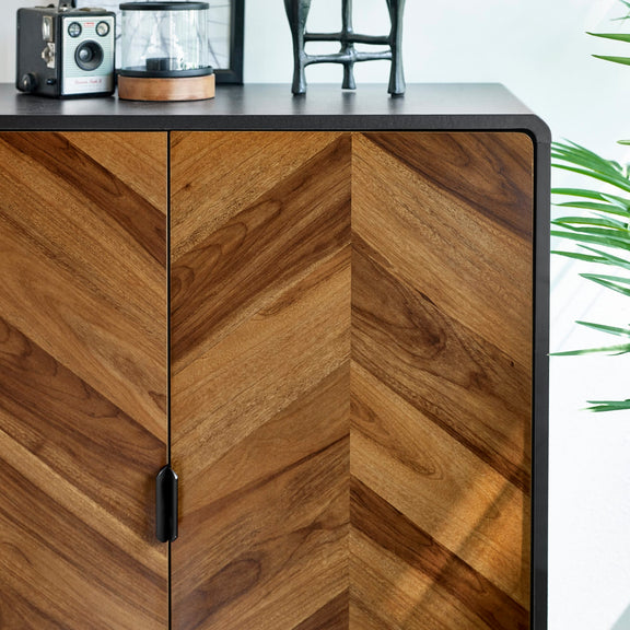 Wooden cabinet with chevron pattern on a white background