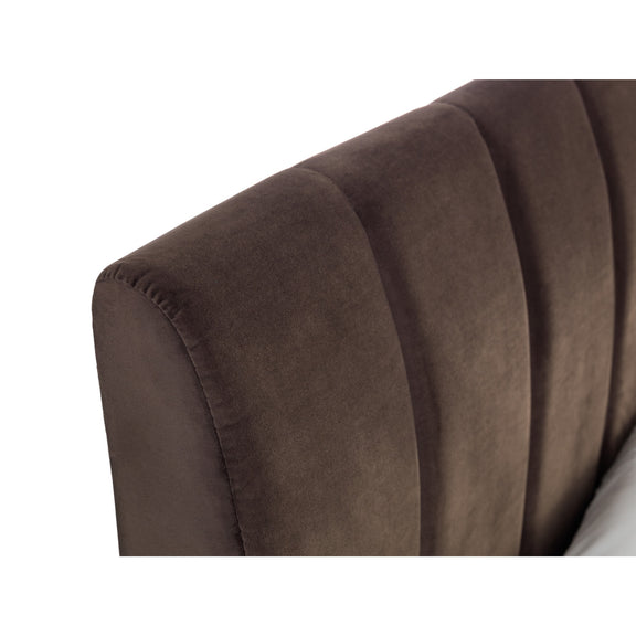 Close-up of a brown upholstered headboard on a white background