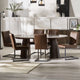 Dining room with a round wooden table and brown chairs in a modern interior setting.