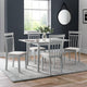 Dining room with a table and chairs in a room with a window and mirror.