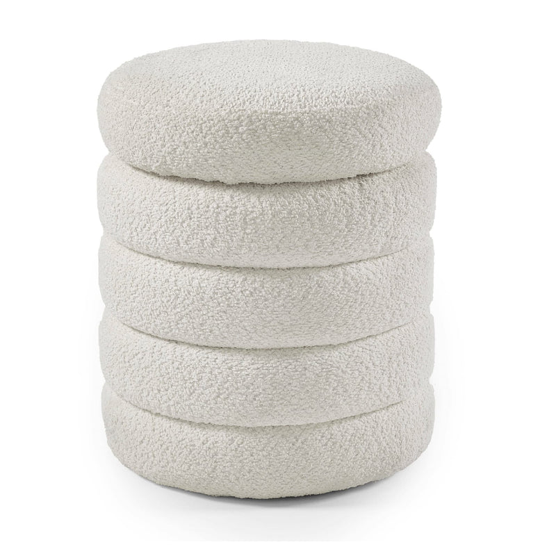 Stack of white textured cushions on a white background