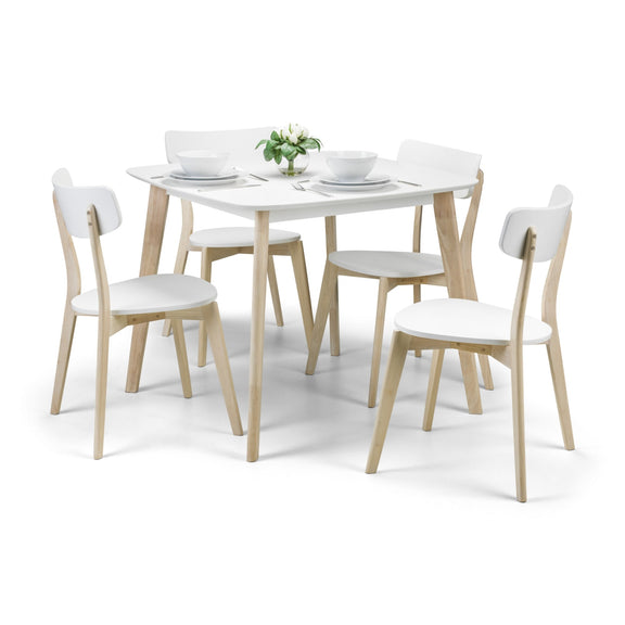 Dining table set with four chairs on a white background