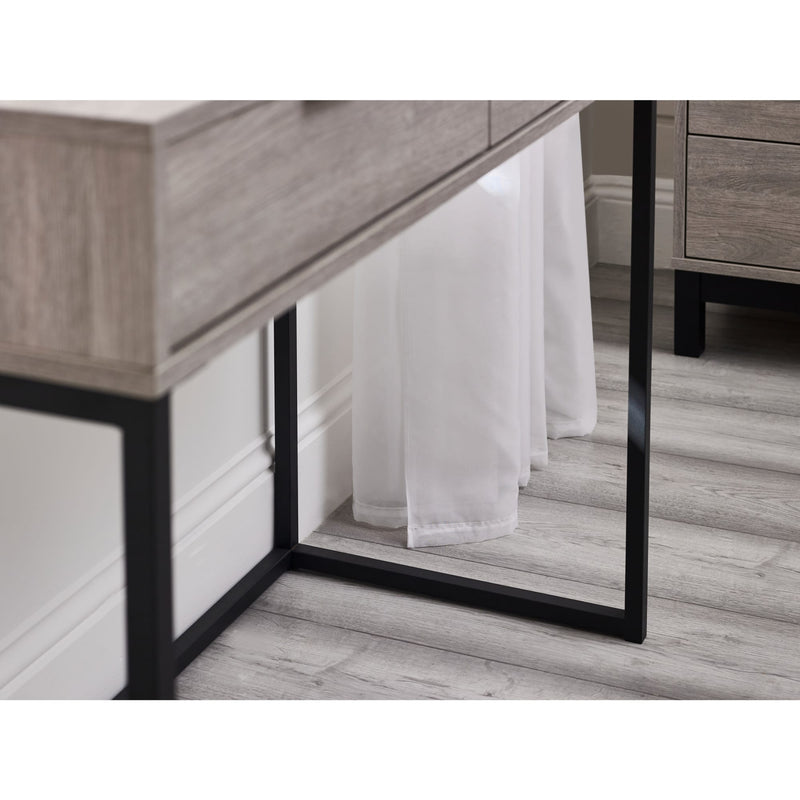 Wooden dresser with a mirror and white curtain reflection