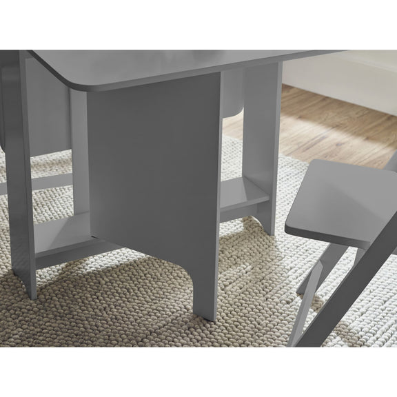 Gray dining table and chairs on a textured rug